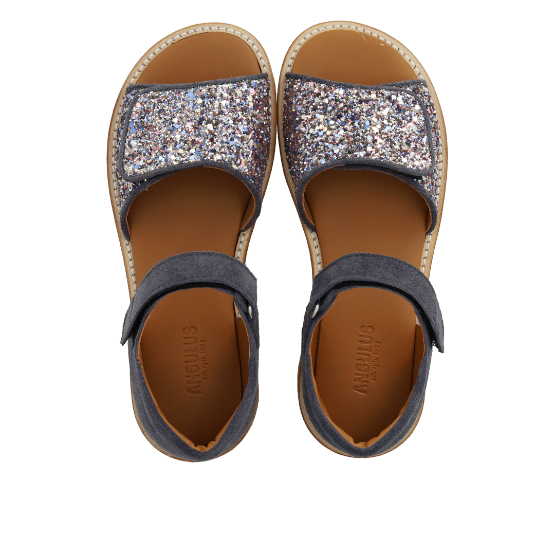 Justerbar sandal i læder med funklende glitter