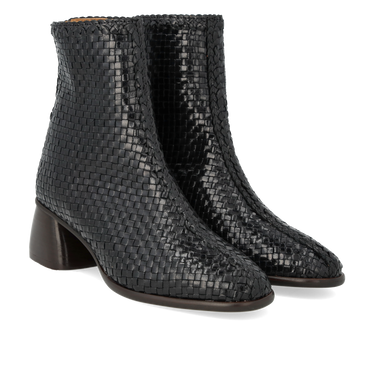 Håndflettet læderstøvlet med skulpturel blokhæl